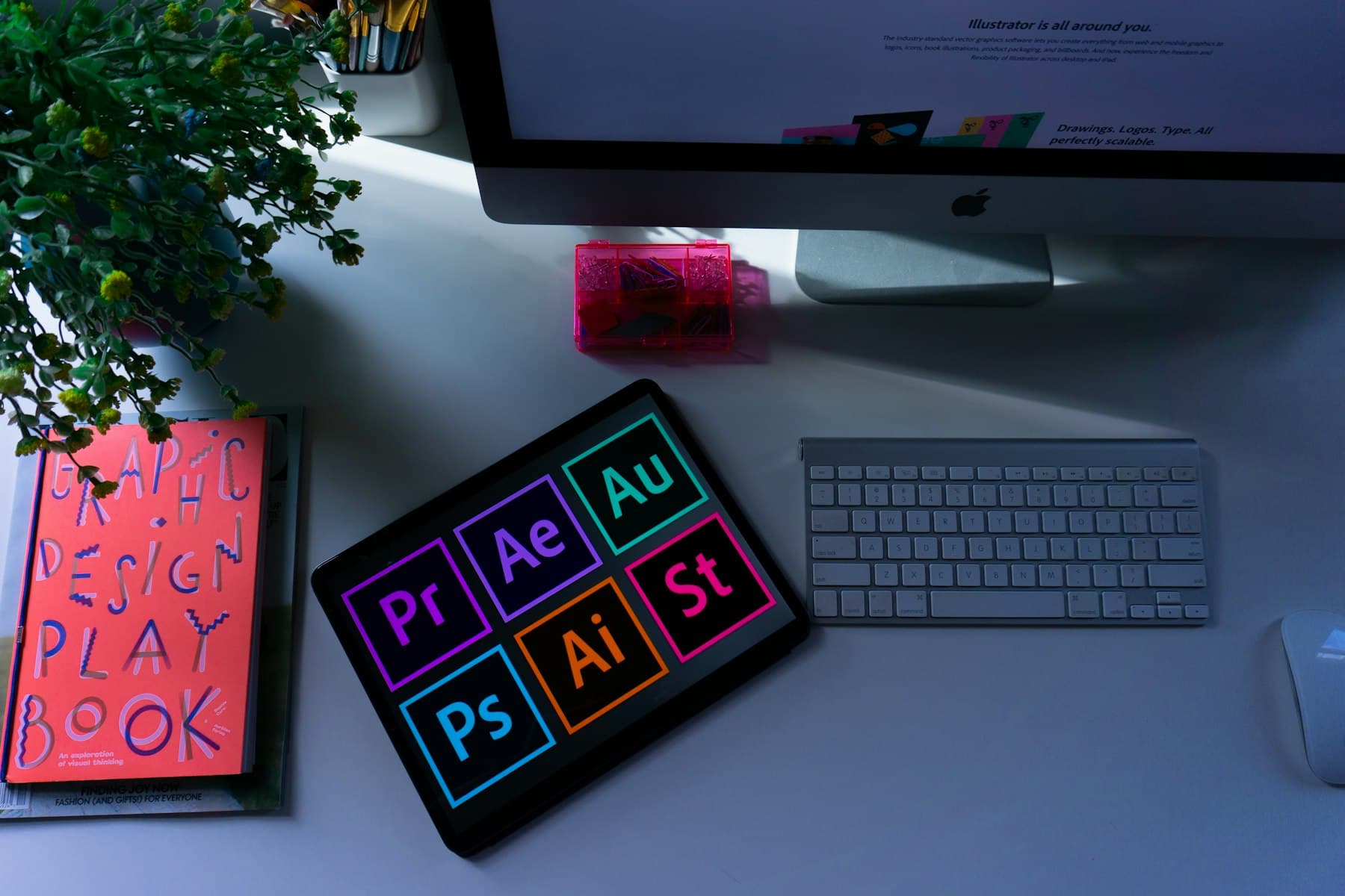 Photo and video editing applications open on a retouching workstation