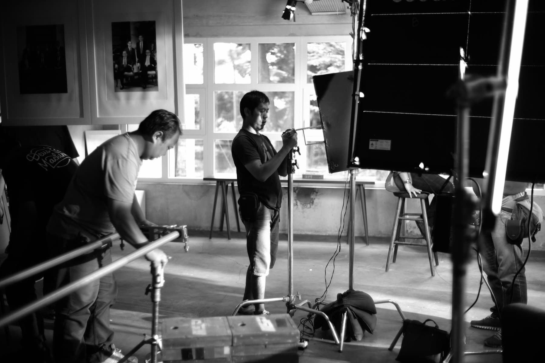 The crew lighting a set between takes on a video production